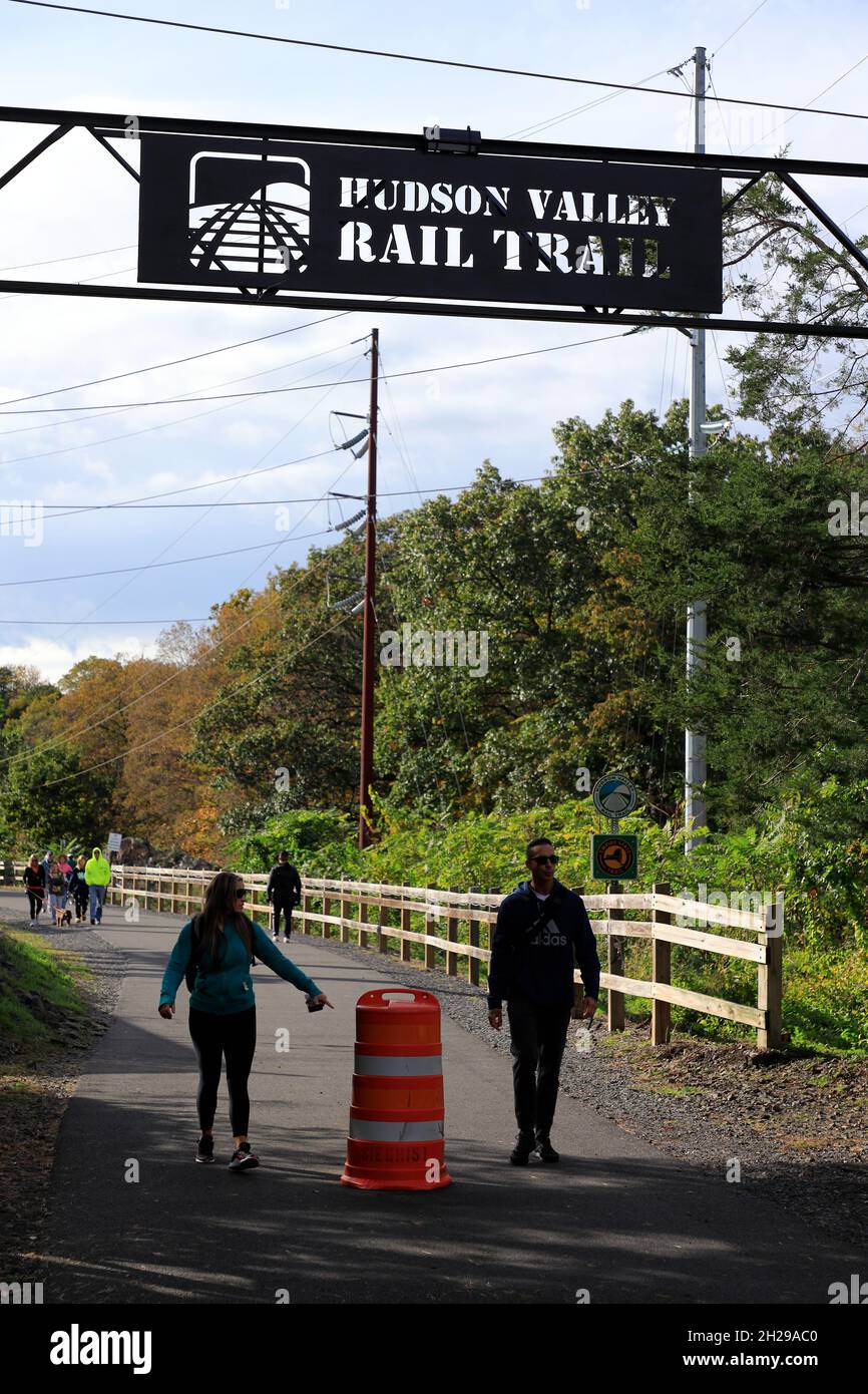 The sign of Hudson Valley Rail Trail over the trail head in Highland