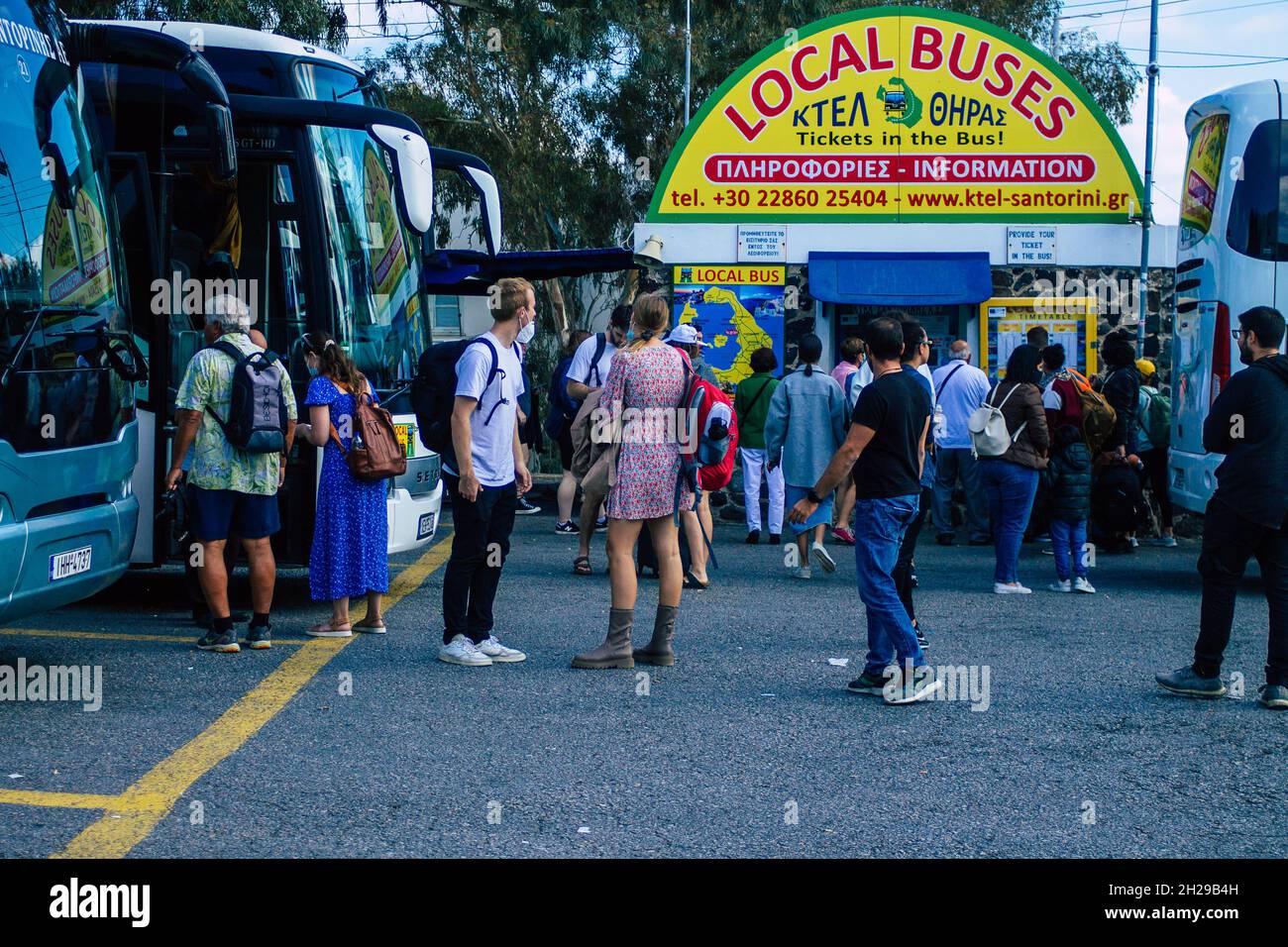 Santorini, Fira, Greece October 20, 2021 Crowd of tourists at the bus station, all the buses
