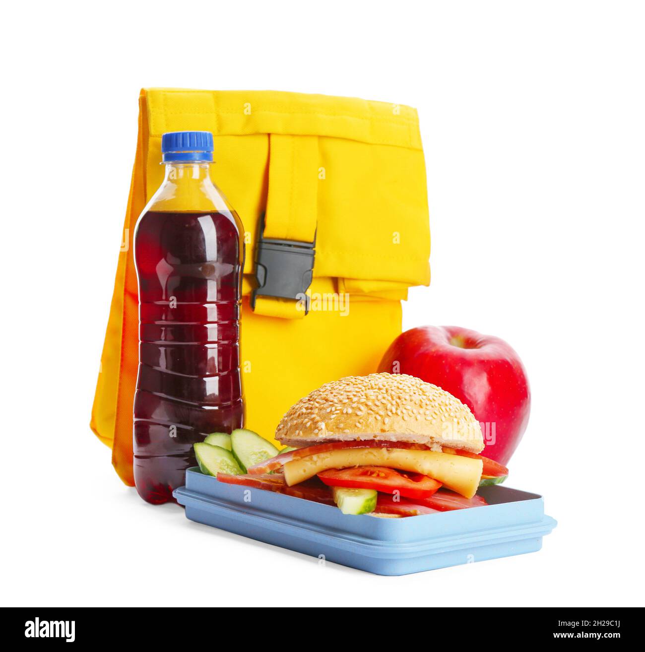 Lunch box with appetizing food, bottle of drink and bag on white