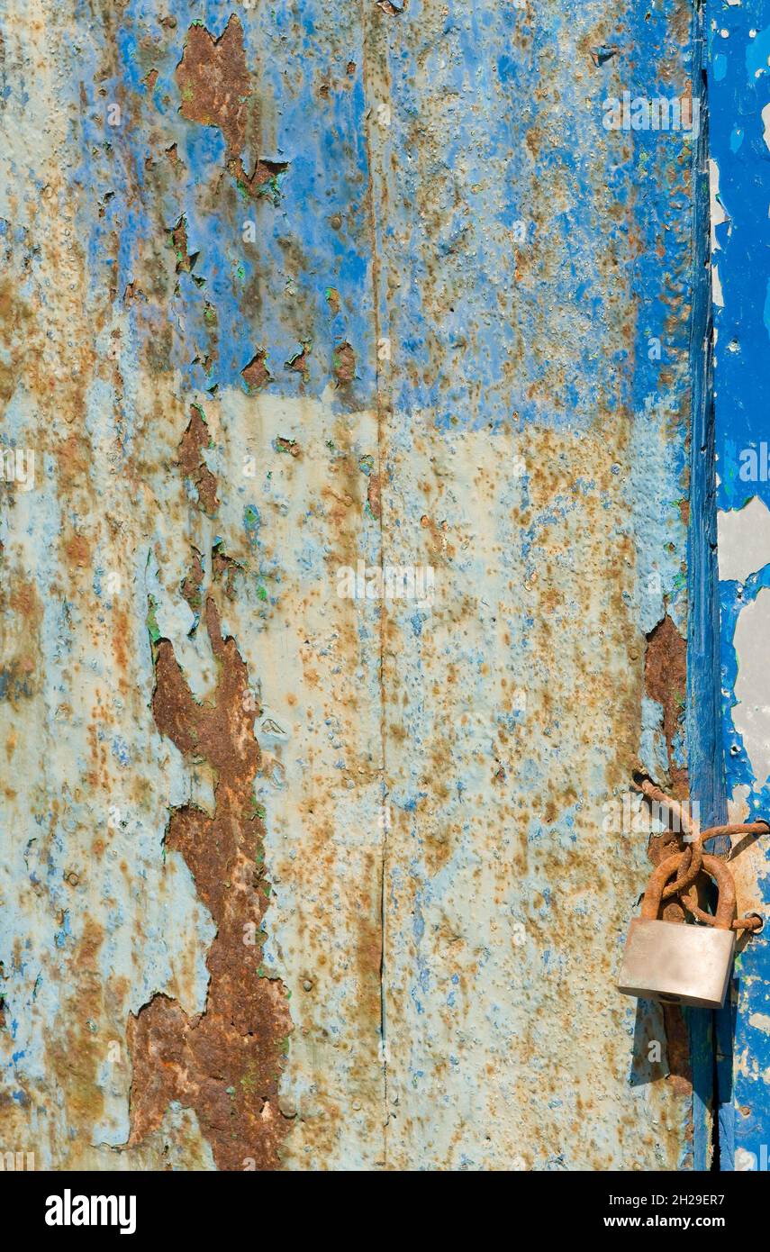 iron doors in the foreground rusty and useless Stock Photo