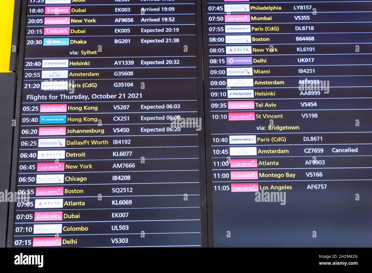 flight arrivals LED board lists all arrival times for individual flights from international flights landing at London Heathrow airport England UK Stock Photo
