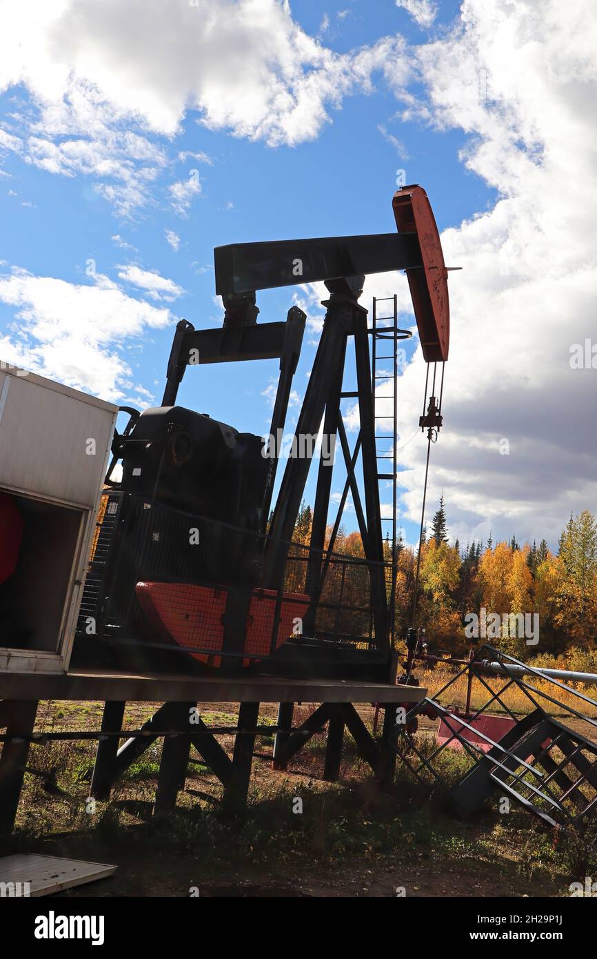 The arm on a jumpjack pumping for oil Stock Photo