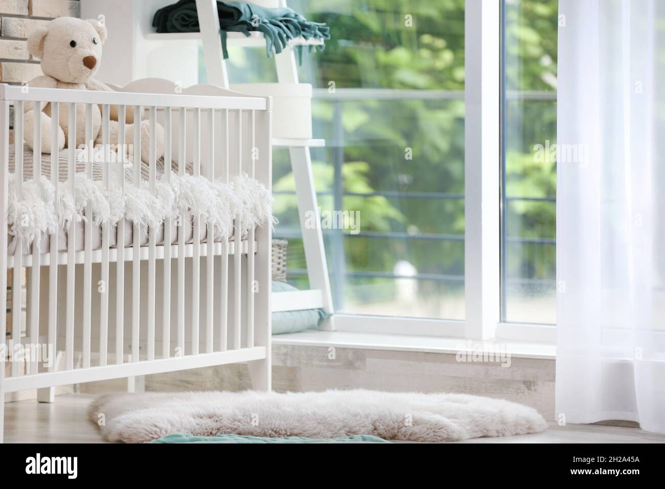 Baby room interior with crib near window Stock Photo Alamy