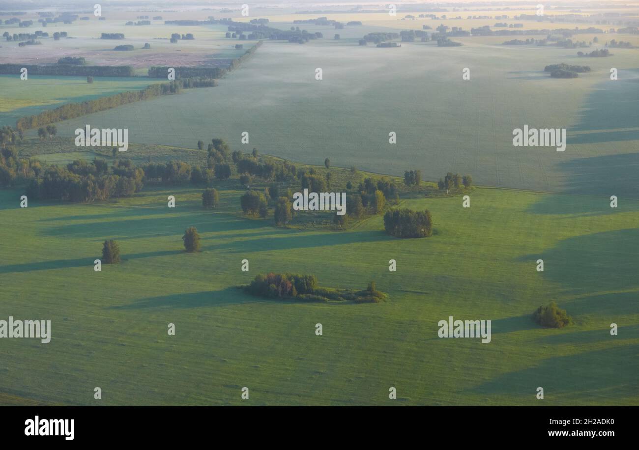 West-Siberian plain. Bird's eye view from plane. Forest-steppe rural ...