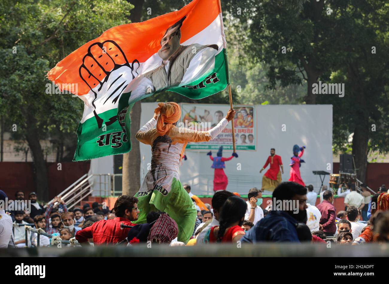 New Delhi, India. 20th Oct, 2021. A supporter unfurled the Congress leader Rahul Gandhi during the flag-off ceremony of Shobha Yatra on the occasion of Maharishi Valmiki Jayanti, at All India Congress Committee headquarter. Valmiki Jayanti, is an annual Indian festival celebrated in particular by the Balmiki religious group, to commemorate the birth of the ancient Indian poet and philosopher Valmiki. (Photo by Naveen Sharma/SOPA Images/Sipa USA) Credit: Sipa USA/Alamy Live News Stock Photo