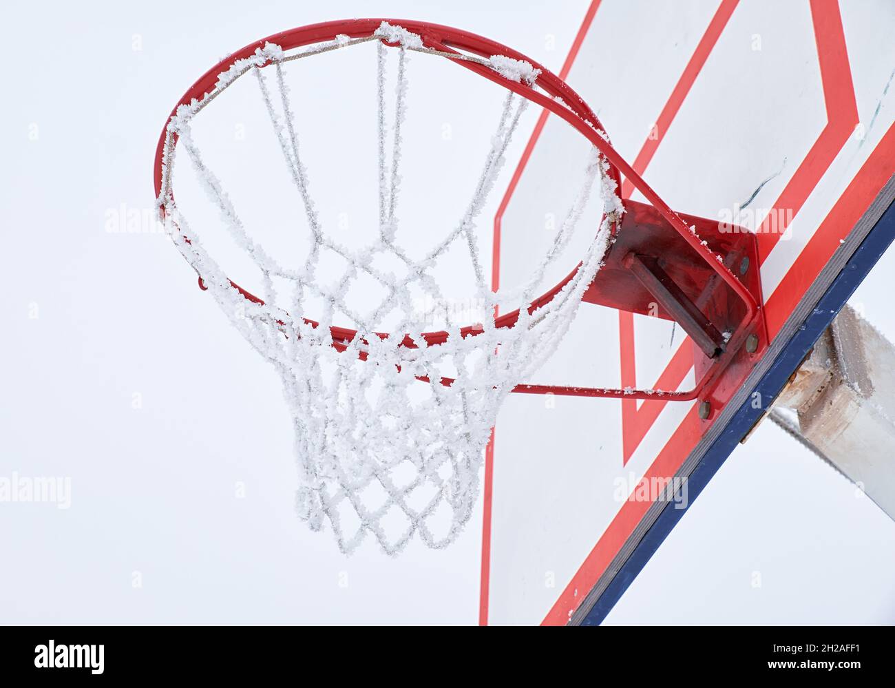 Outdoor basketball hoop with net, covered by hoarfrost Stock Photo - Alamy