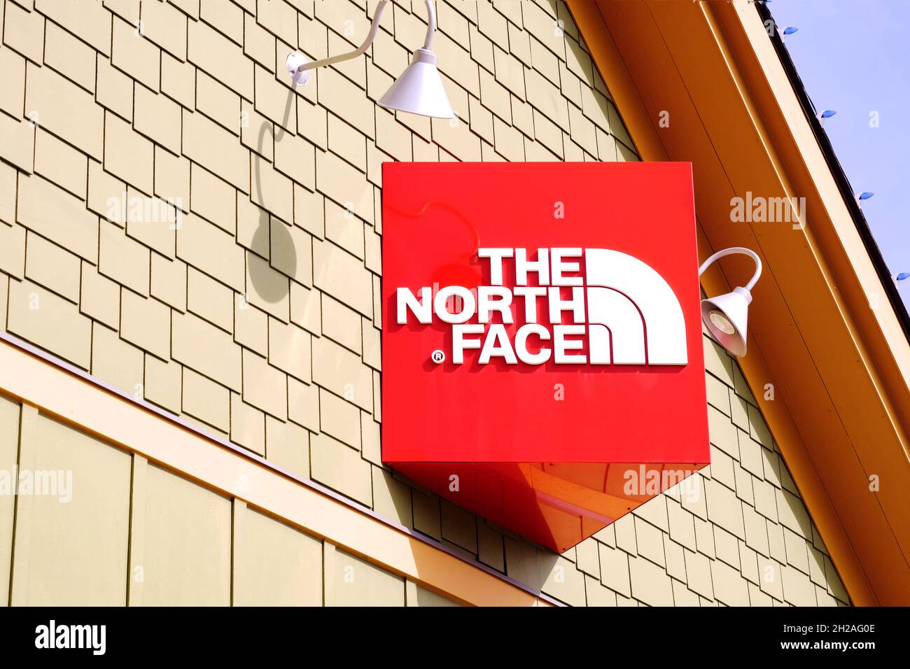 The north face store at Blue Mountain resort. Logo and company name on decorative exterior wall. Chain retailer known for outerwear, apparel gear. Stock Photo