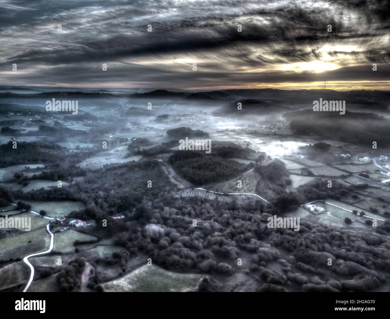 Landscape of a mysterious valley in mist and gloom Stock Photo - Alamy