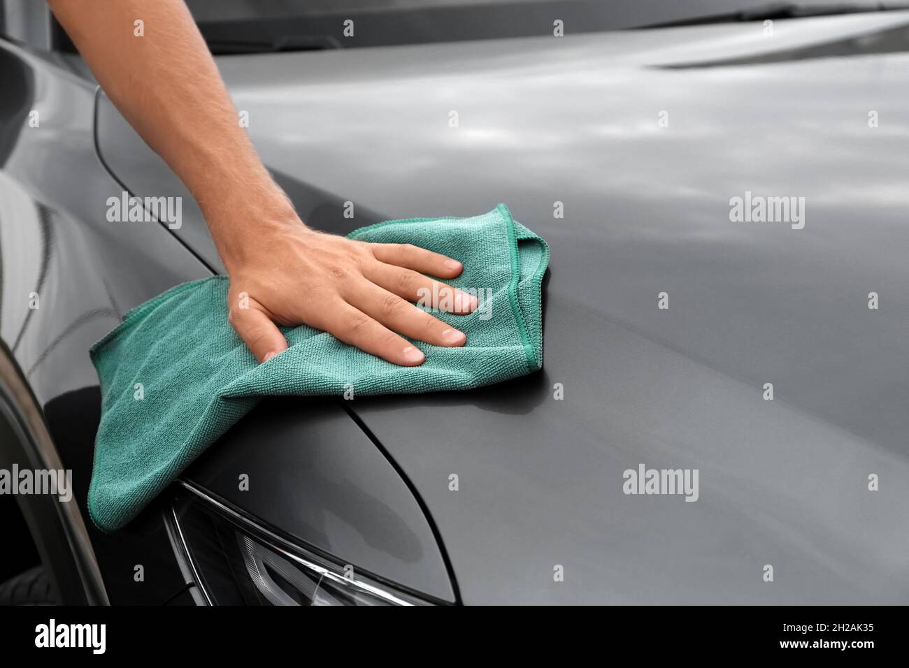 Man washing car hood with rag, closeup Stock Photo Alamy