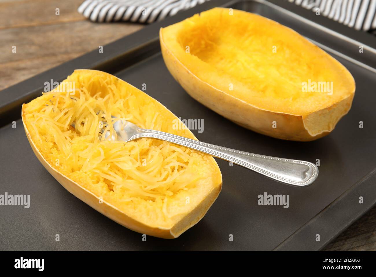 Cooked spaghetti squash and fork on baking sheet Stock Photo Alamy