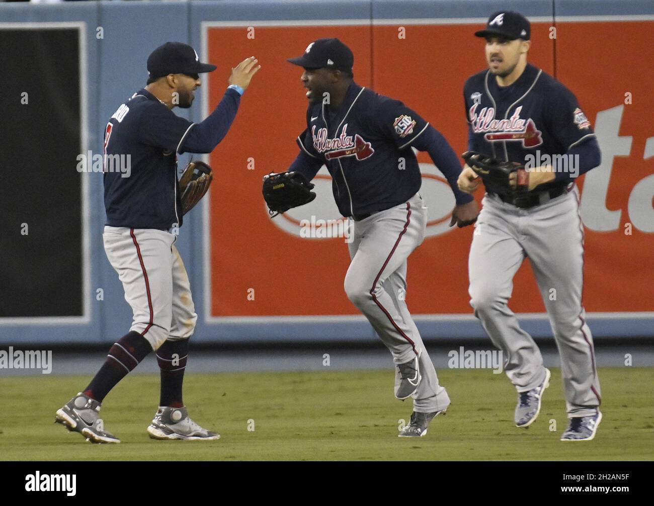 Los Angeles, United States. 20th Oct, 2021. Outfielders (L-R) Eddie Rosario, Guilermo Heredia, and Adam Duvall celebrate defeating the Los Angels Dodgers in game four of the MLB NLCS at Dodger Stadium on Wednesday, October 20, 2021 in Los Angeles, California. Winning game four 9-2, Atlanta leads Los Angeles 3-1 in the championship series. Photo by Jim Ruymen/UPI Credit: UPI/Alamy Live News Stock Photo