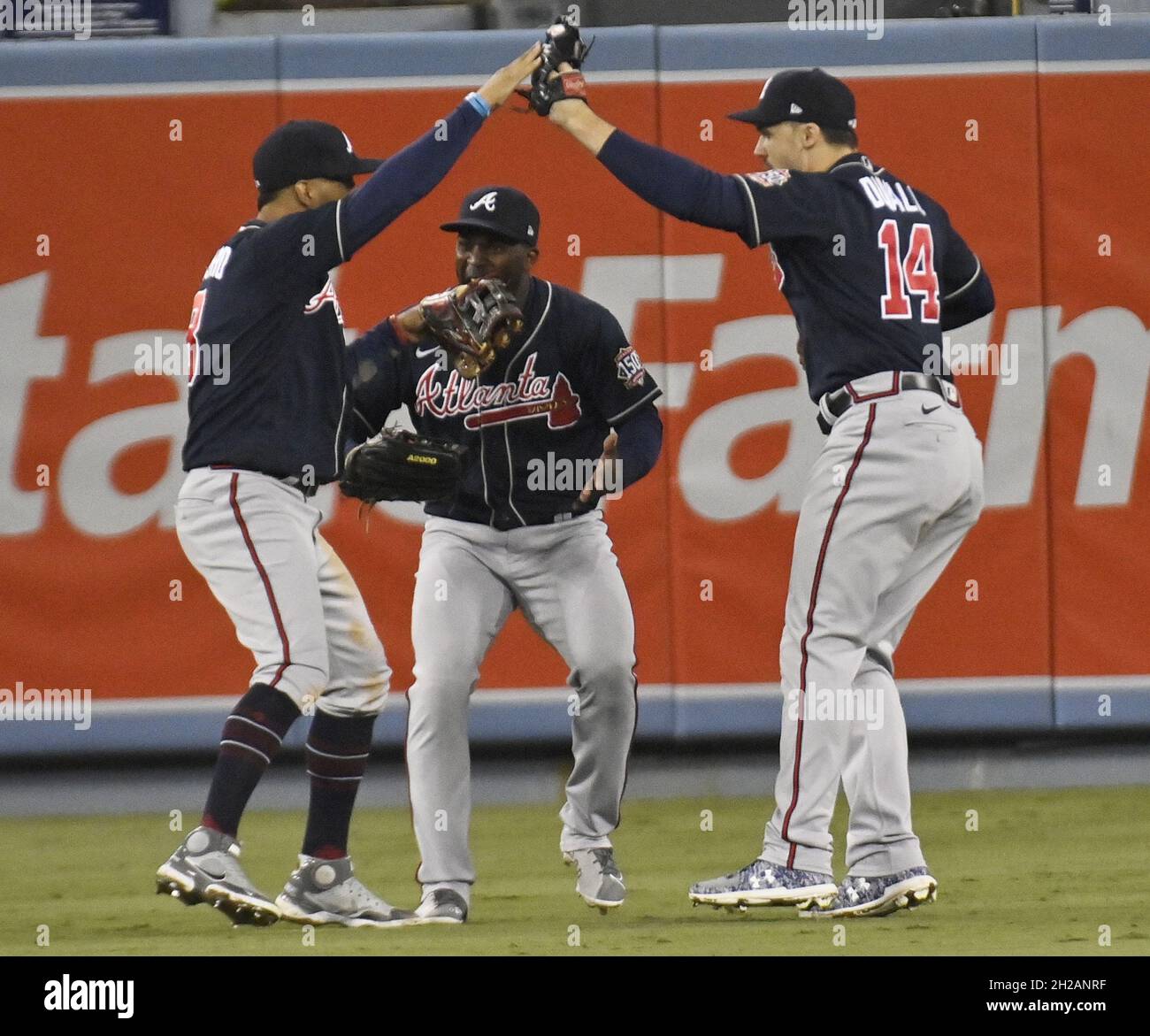 Los Angeles, United States. 21st Oct, 2021. Outfielders (L-R) Eddie Rosario, Guilermo Heredia, and Adam Duvall celebrate defeating the Los Angels Dodgers in game four of the MLB NLCS at Dodger Stadium on Wednesday, October 20, 2021 in Los Angeles, California. Winning game four 9-2, Atlanta leads Los Angeles 3-1 in the championship series. Photo by Jim Ruymen/UPI Credit: UPI/Alamy Live News Stock Photo