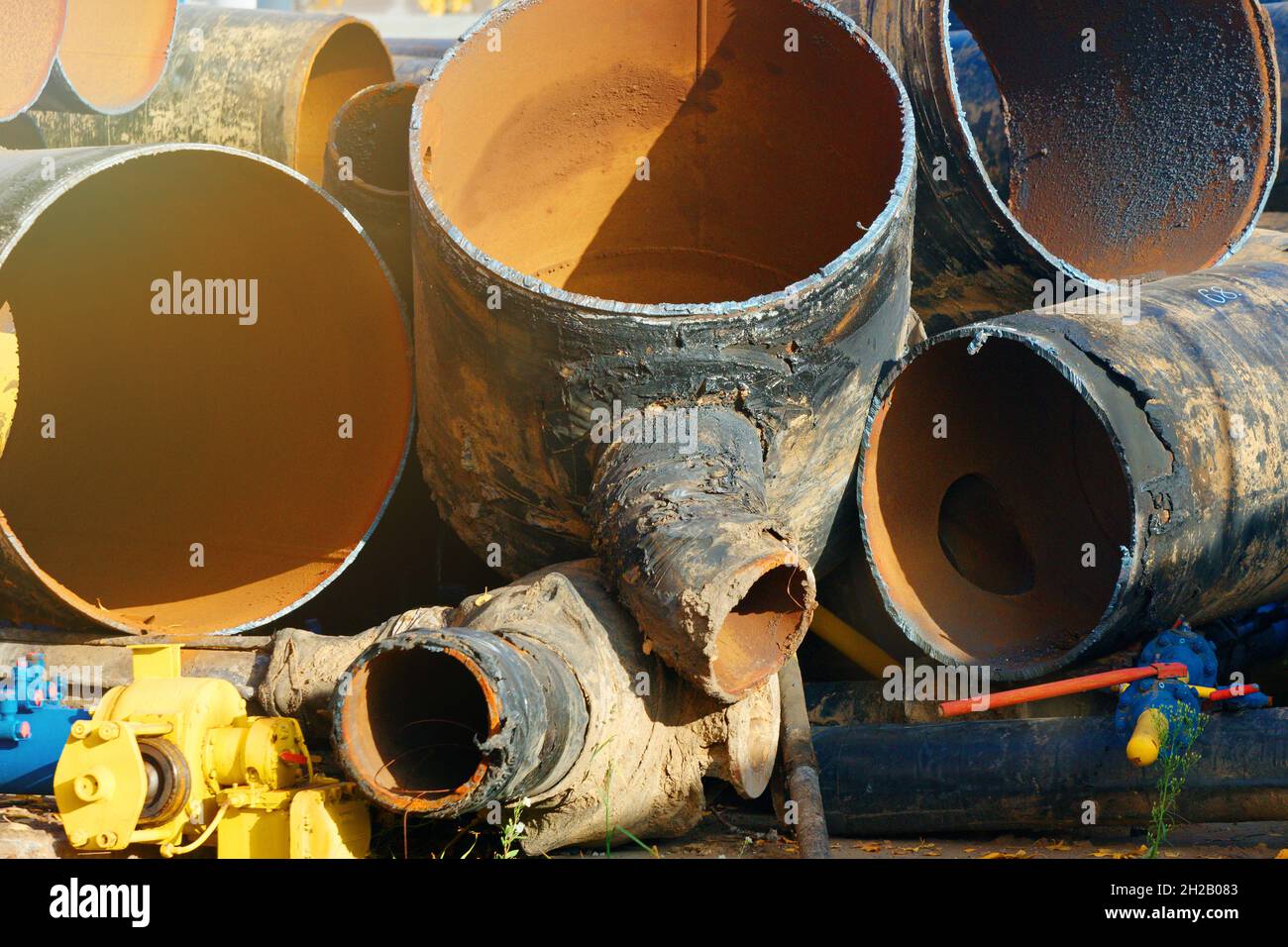 Scrap metal dump. Old used gasification pipes are cut into pieces and