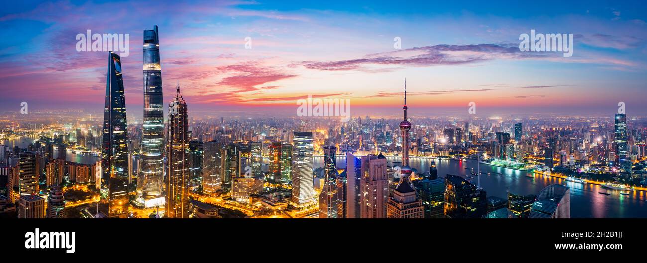 Aerial view of modern city skyline and buildings at sunrise in Shanghai ...