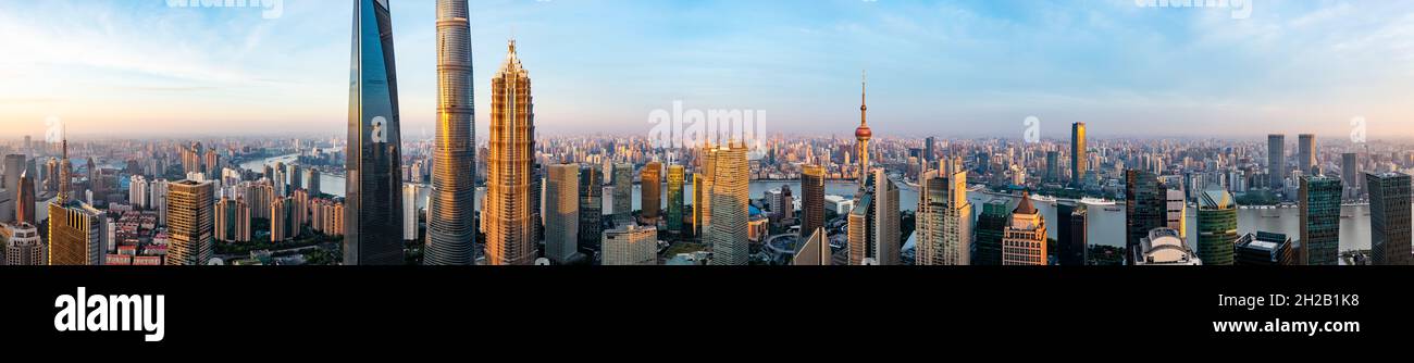 Aerial view of modern city skyline and buildings at sunrise in Shanghai ...