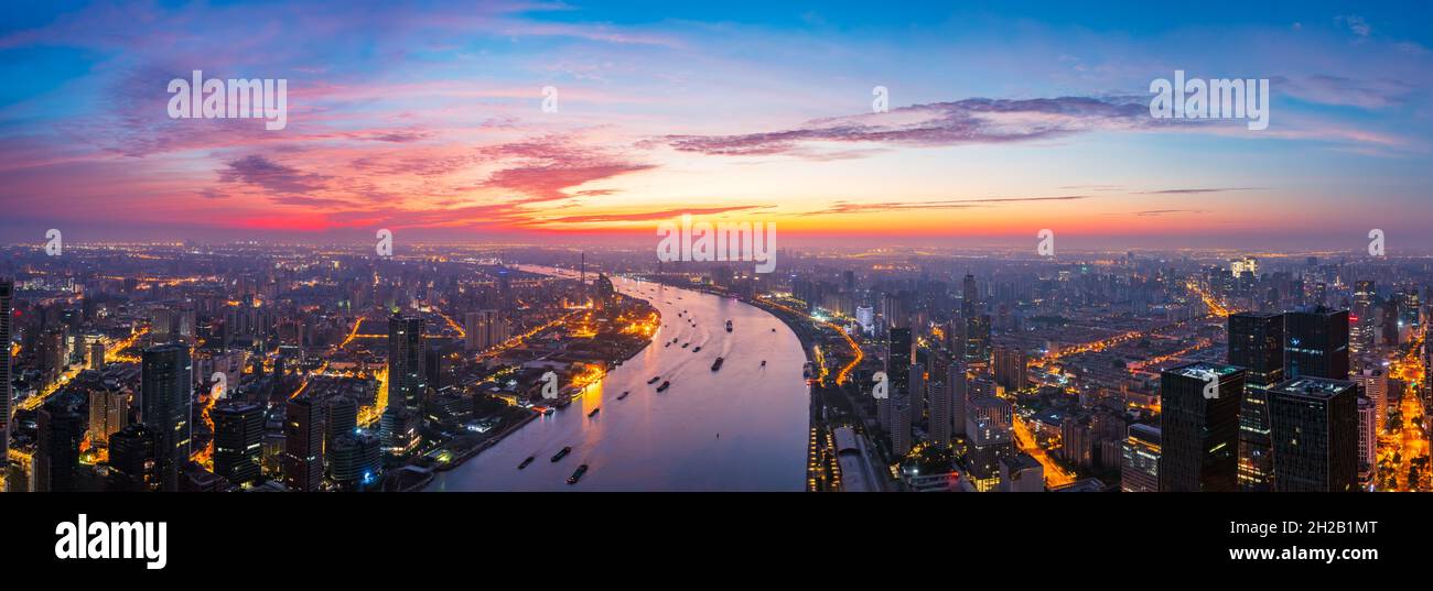 Aerial view of modern city skyline and buildings at sunrise in Shanghai ...