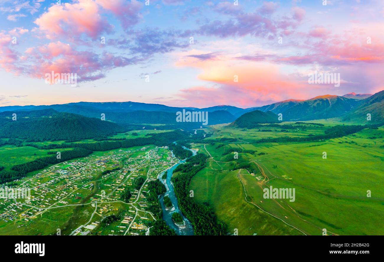 Beautiful Hemu Village with natural scenery in Xinjiang,green mountain and forest with rivers.Hemu Village is a famous travel destination in China.Aer Stock Photo