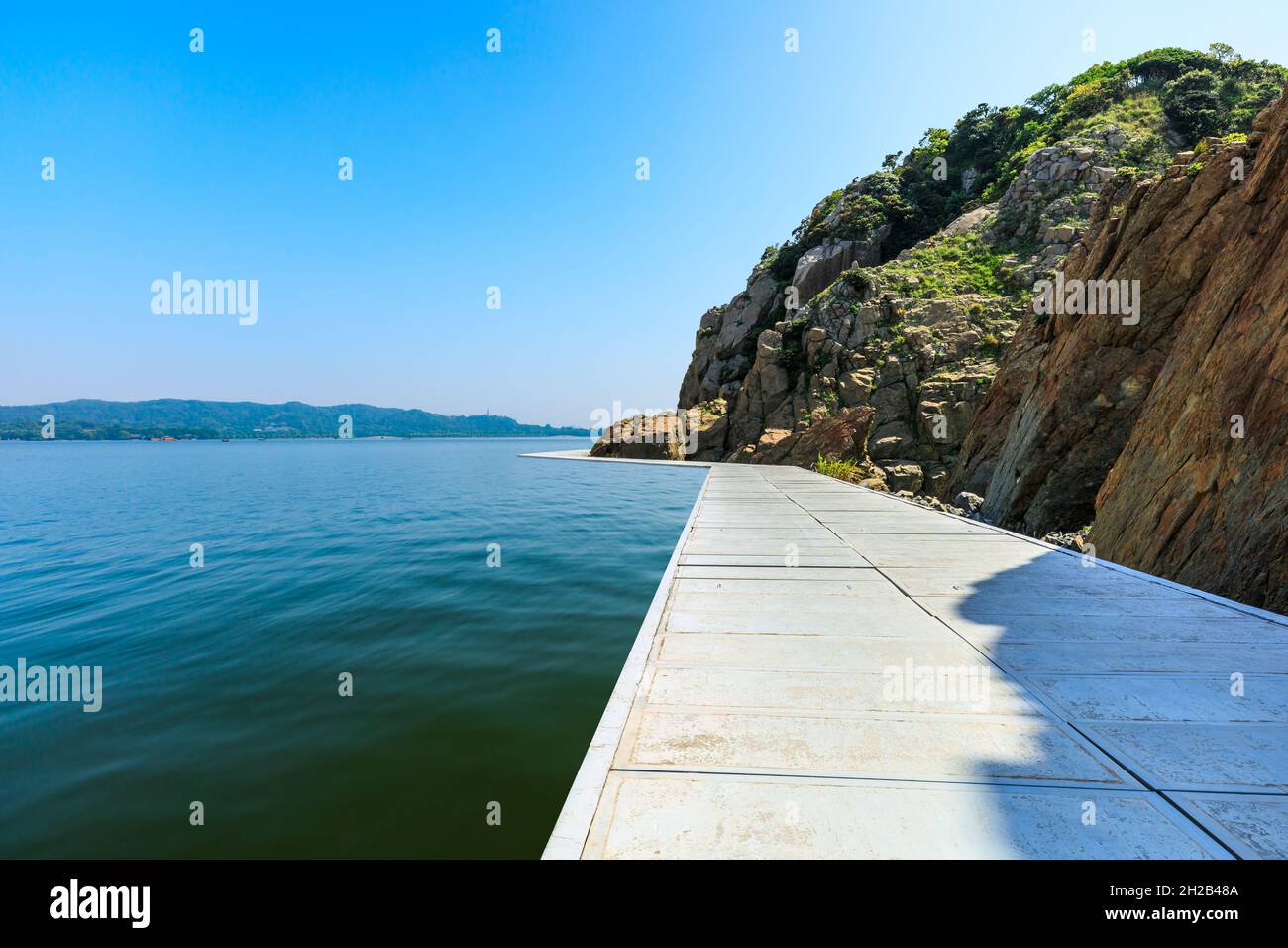 Lakeside walkways and mountains with river landscape. Stock Photo