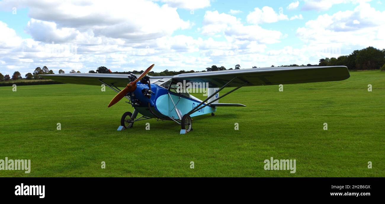 Vintage 1931 Civilian Coupe 02 G-ABNT  aircraft  on airstrip grass. Stock Photo
