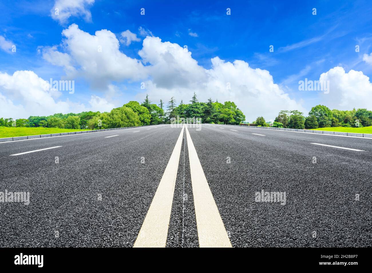 Asphalt road and green trees in spring season Stock Photo - Alamy