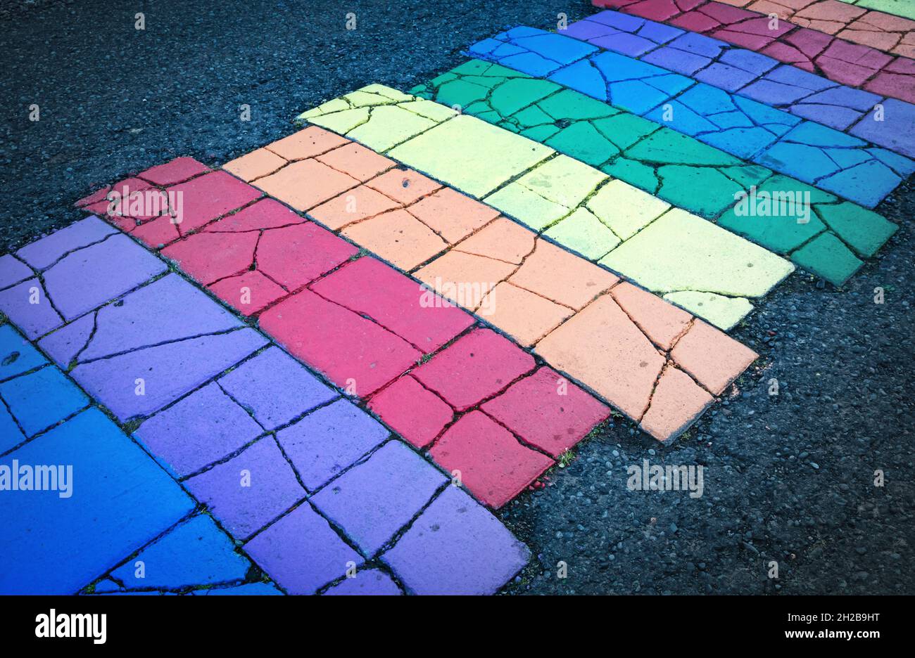 Gay pride rainbow pathway painted onto asphalt, Iceland Stock Photo