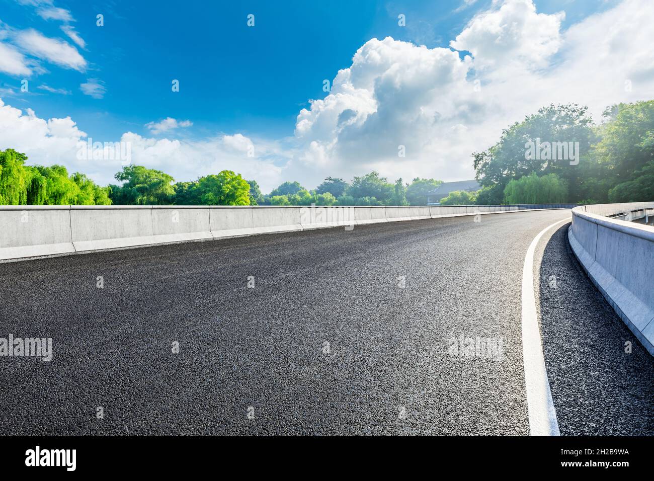 Empty asphalt road and green trees in spring season Stock Photo - Alamy
