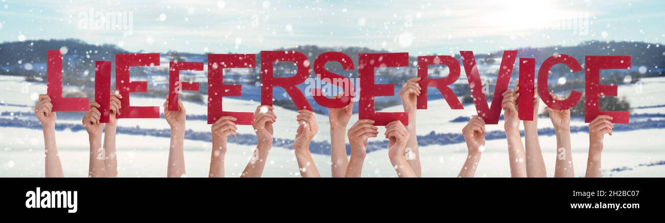 People Hands Holding Lieferservice Means Delivery Service, Snowy Background Stock Photo