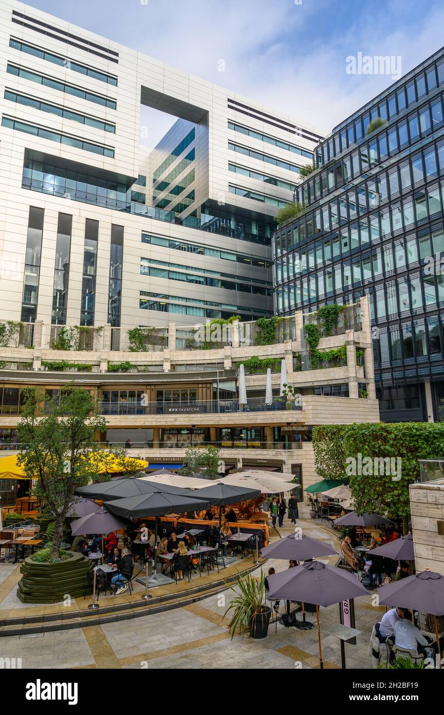 Broadgate Circle with shops and restaurants and USB bank's white building at 5 Broadgate, London, England. Stock Photo