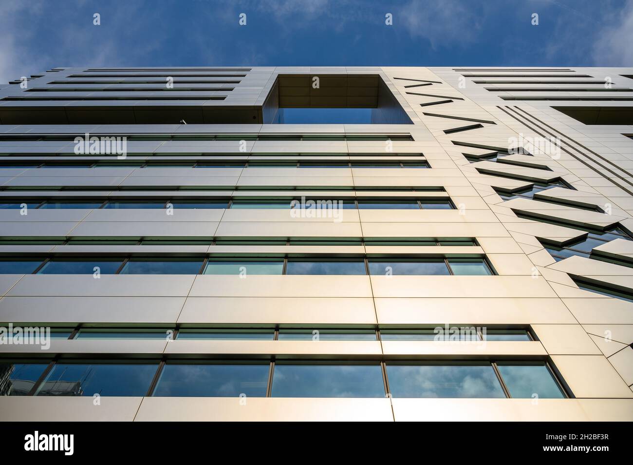 A skyward lview up the exterior front facade of the USB AG bank office block at 5 Broadgate, London, England. Stock Photo
