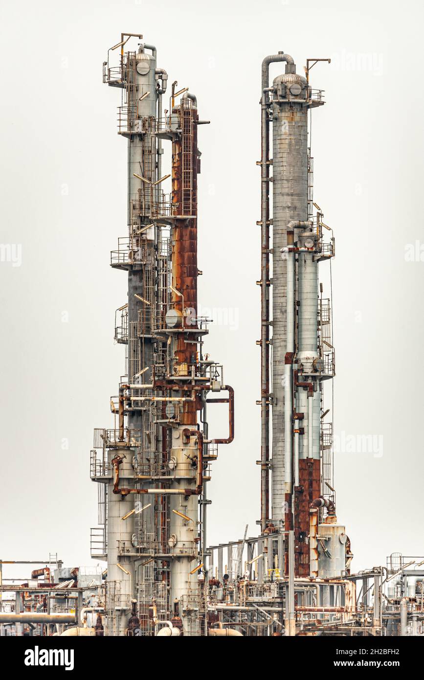 Pipelines of a oil and gas refinery industrial plant on a over cast day Stock Photo