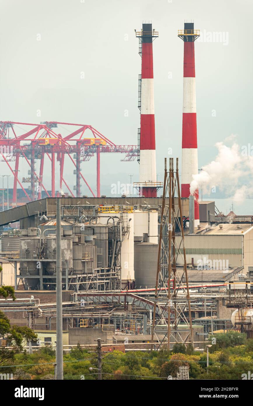 red and white smokestacks in a Chemical plant Stock Photo