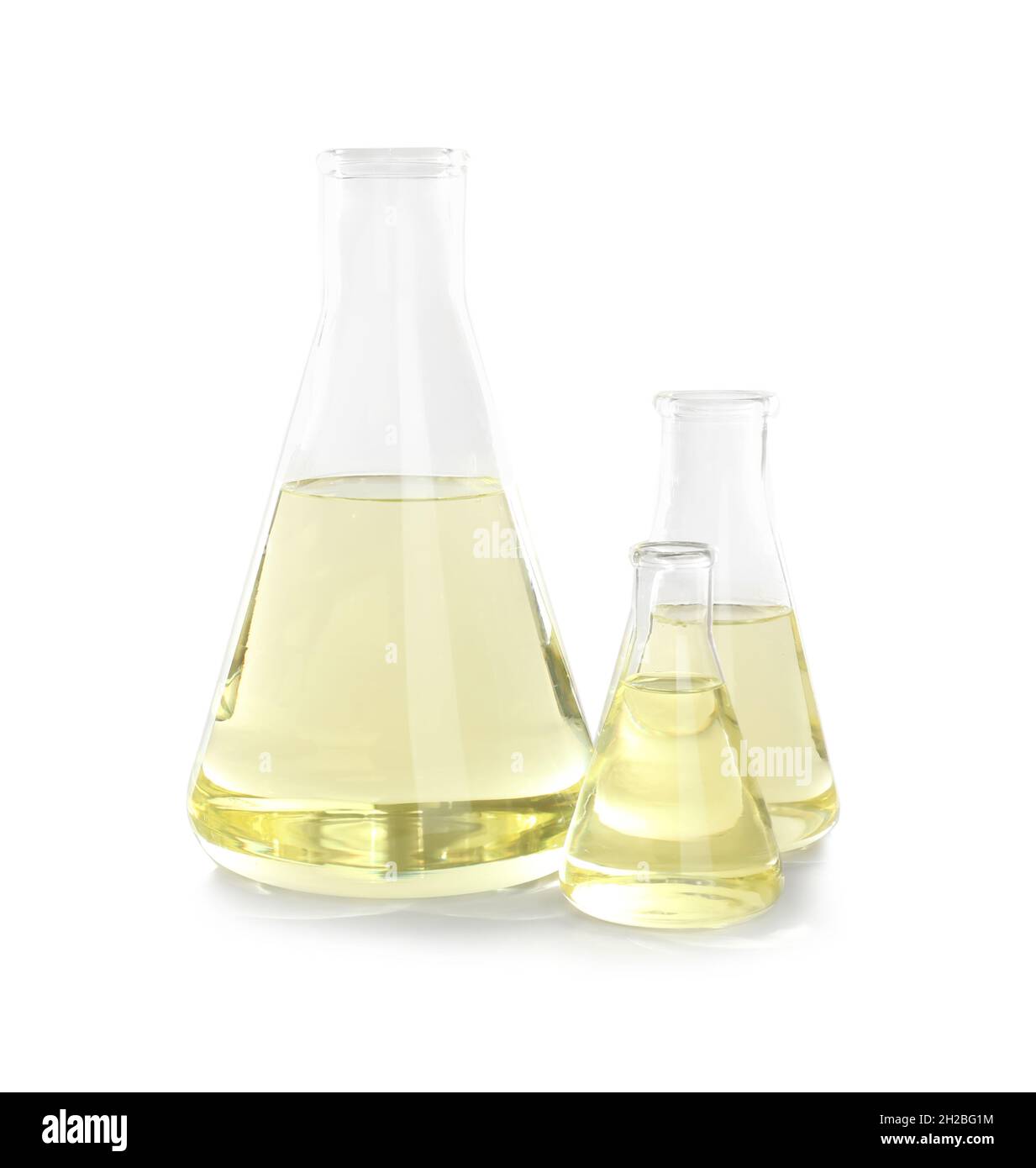 Laboratory glassware with liquid on white background. Chemical analysis ...