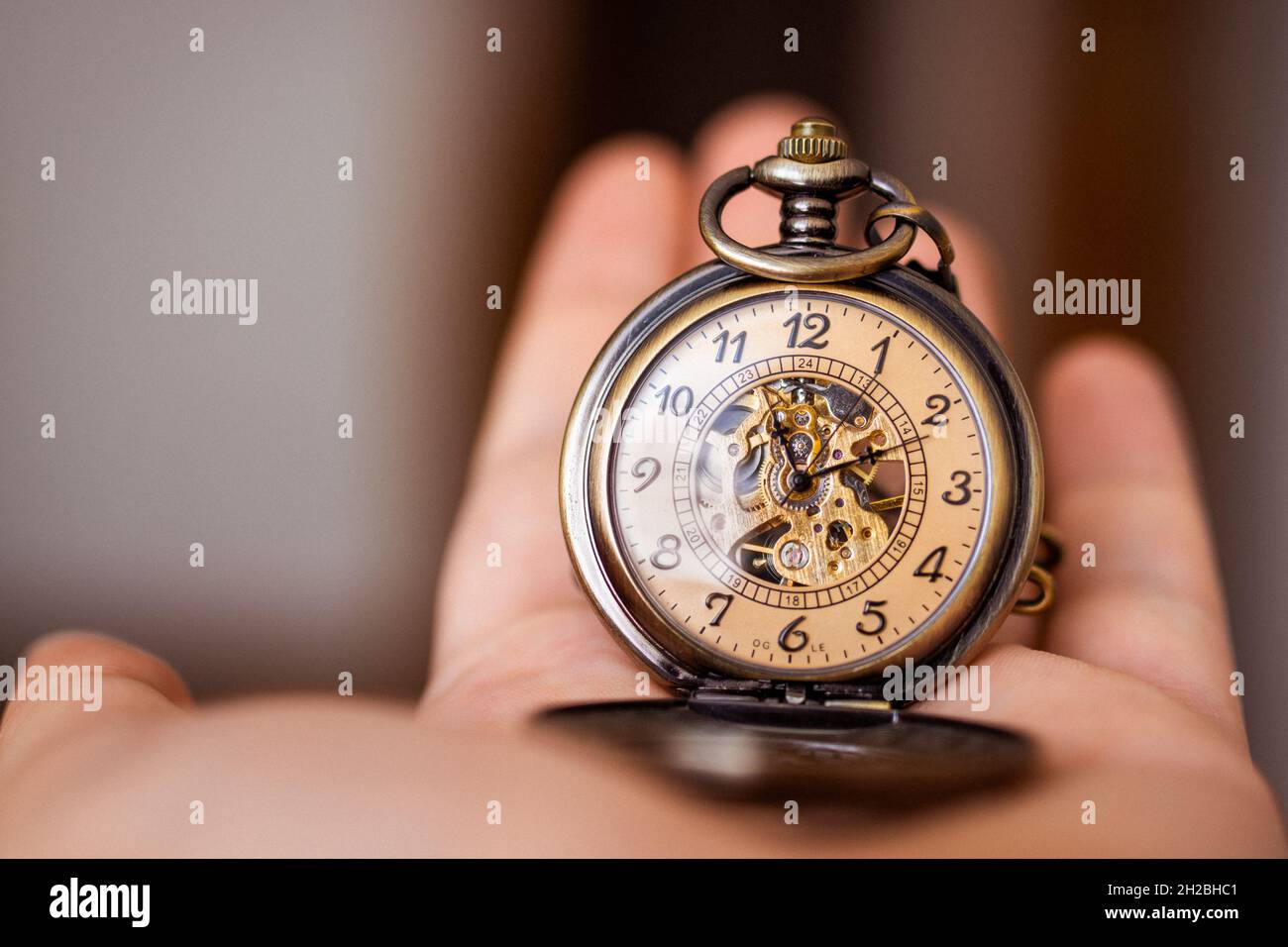 A man holding vintage pocket watch. Time concept. High quality photo Stock Photo