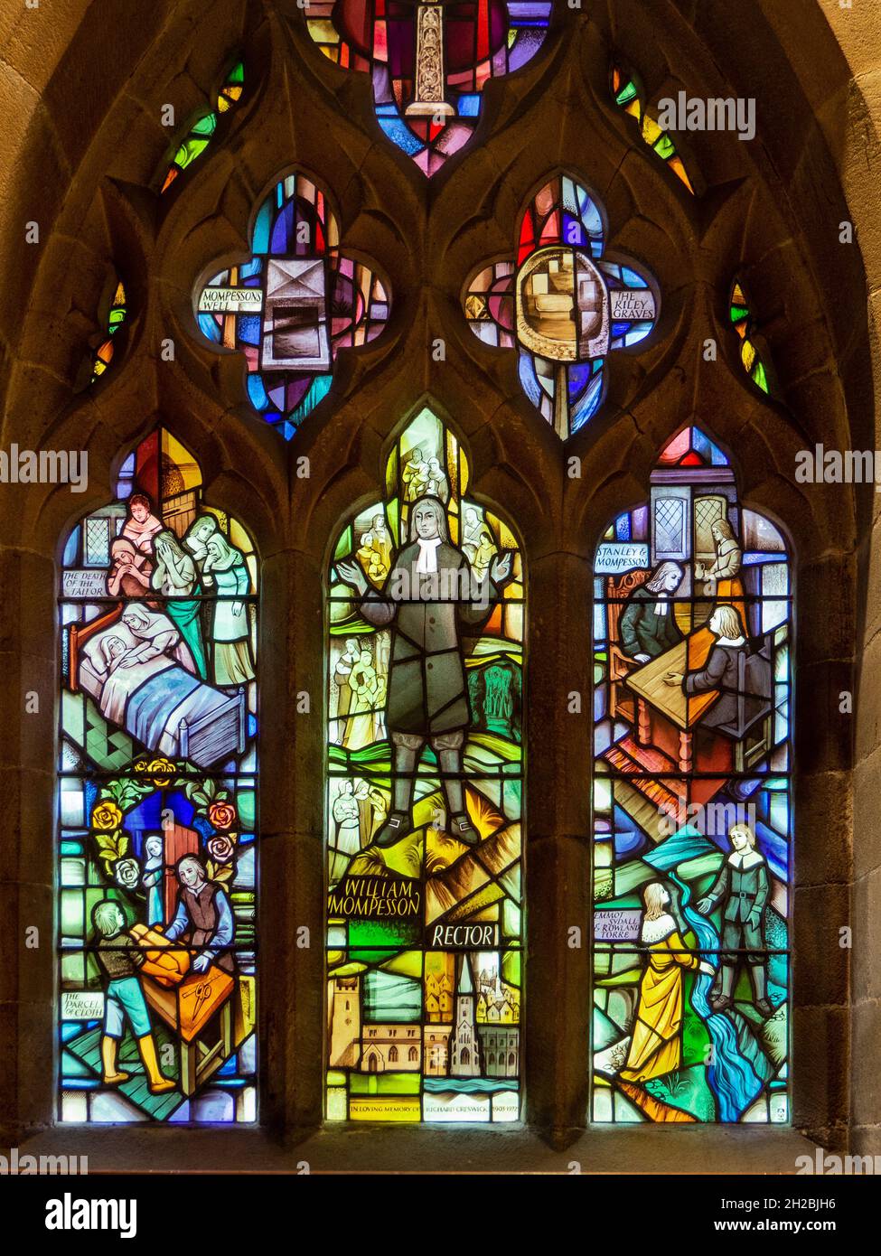 The Plague Window in St Lawrence Church, Eyam, Derbyshire, UK; designed by Alfred Fisher in 1985 and tells the story of the arrival of the plague. Stock Photo