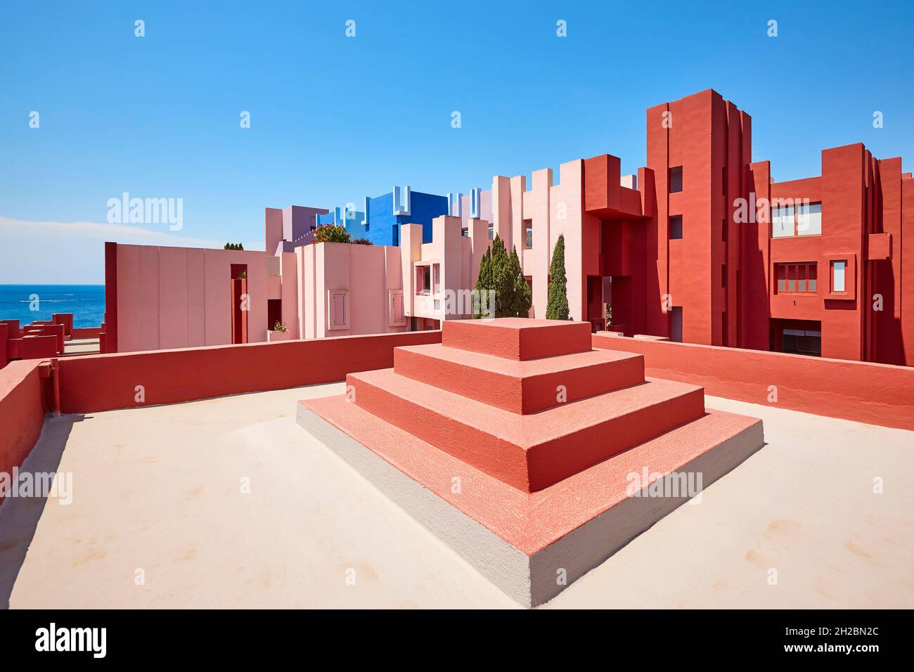 Geometric building construction. The red wall, La manzanera. Calpe, Spain Stock Photo