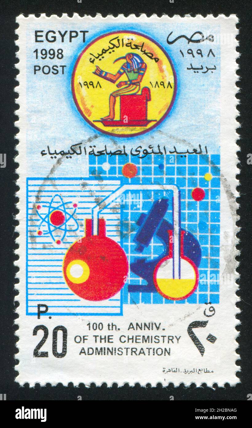 EGYPT - CIRCA 1998: stamp printed by Egypt, shows Microscope, flask, emblem, circa 1998 Stock Photo