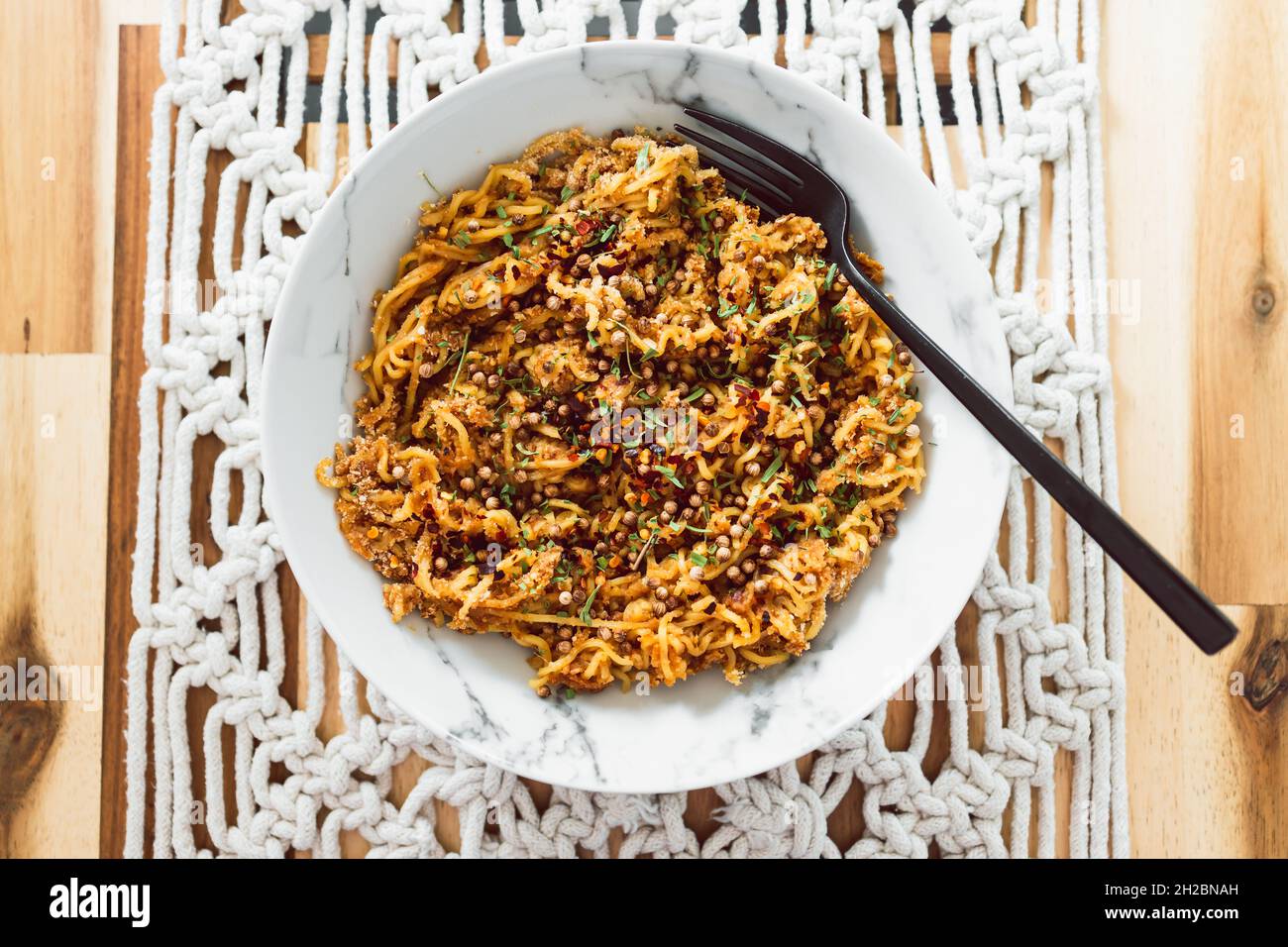 vegan ginger noodles with chilli flakes coriander seeds and tarragon