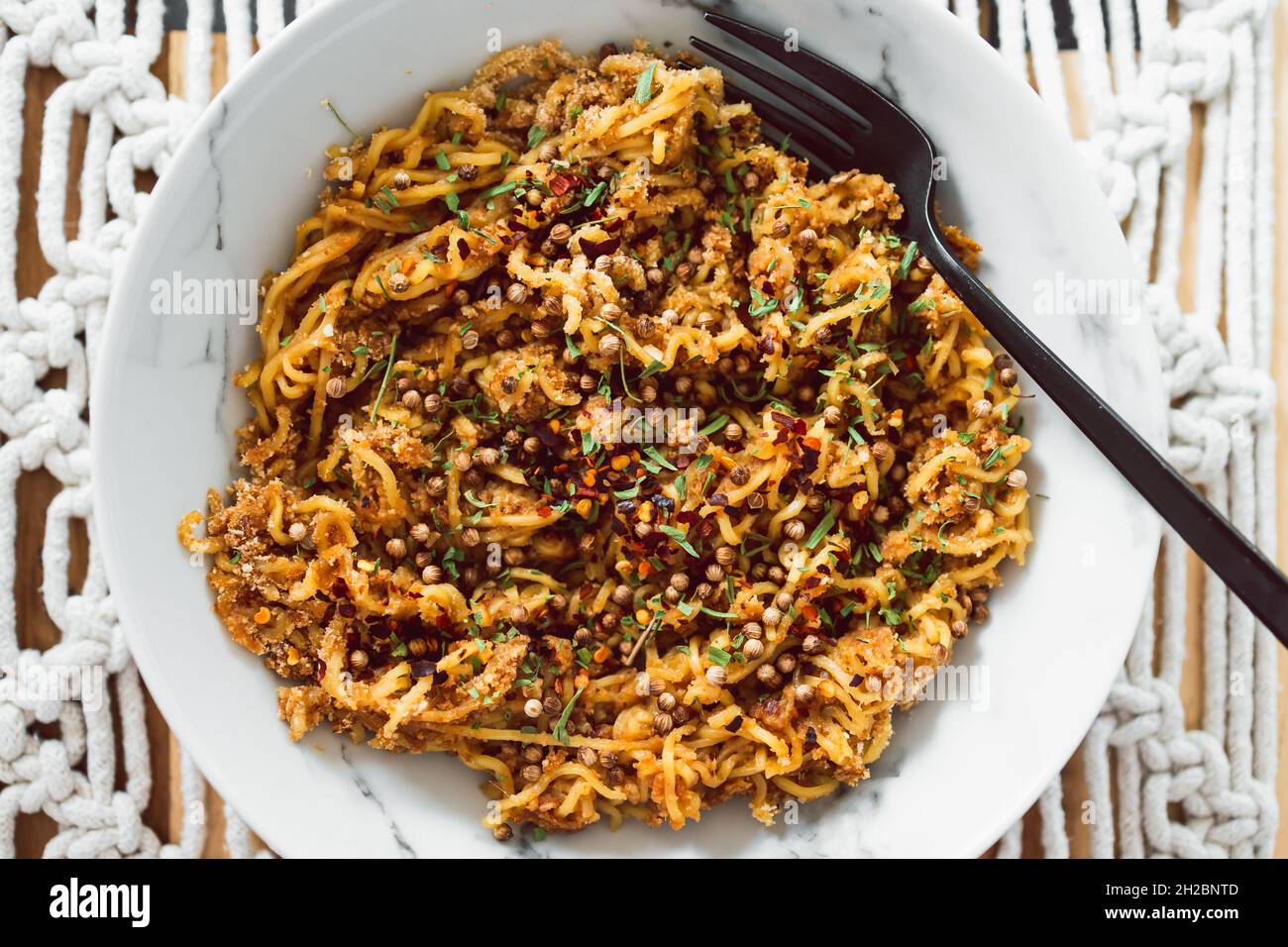 vegan ginger noodles with chilli flakes coriander seeds and tarragon