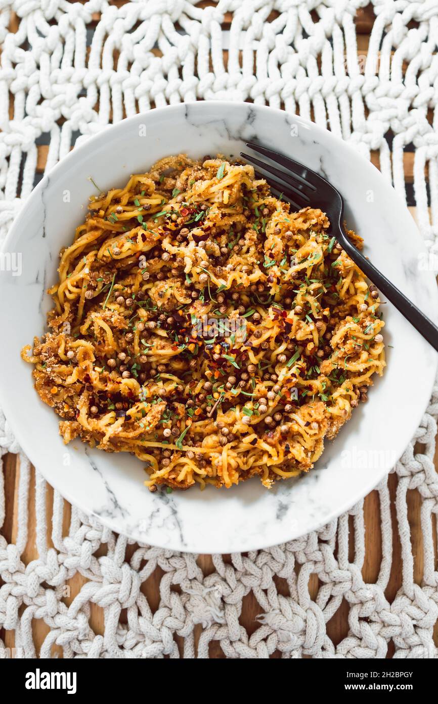 vegan ginger noodles with chilli flakes coriander seeds and tarragon