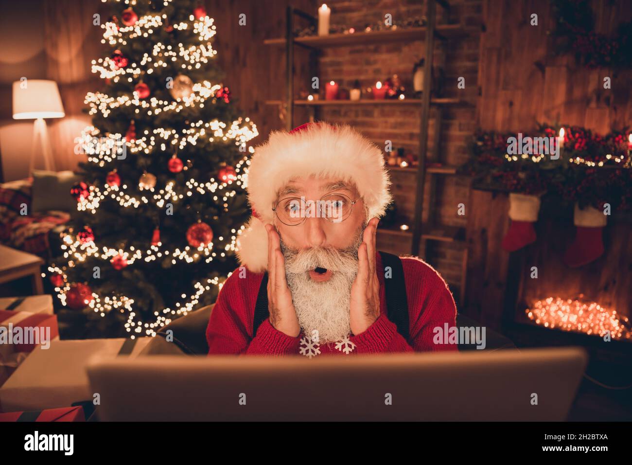 Photo of funny shocked mature man dressed santa costume arms cheeks ...
