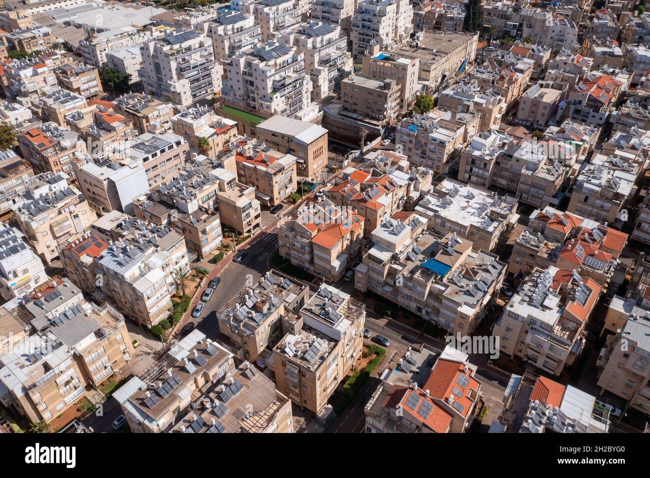 Bnei Brak city rooftops, Low altitude aerial view. Stock Photo
