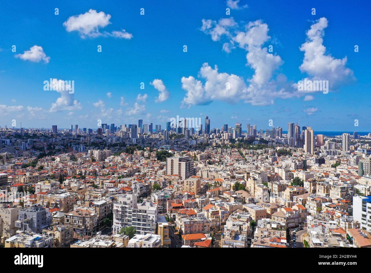 Tel Aviv skyline over neighboring Bnei Brak lower houses, Aerial view. Stock Photo