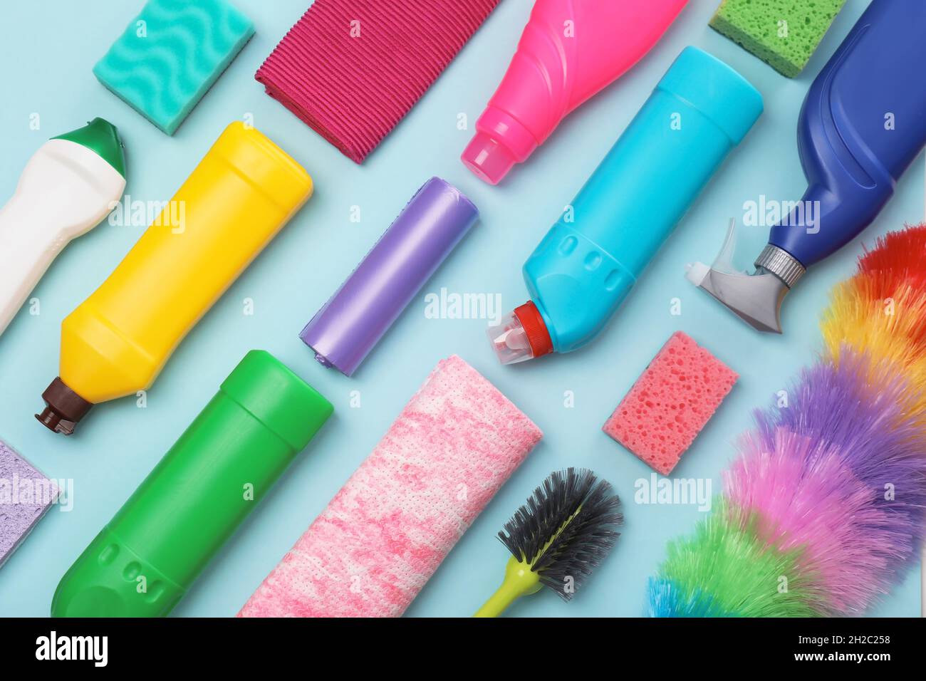 Flat lay composition with cleaning supplies on color background Stock Photo