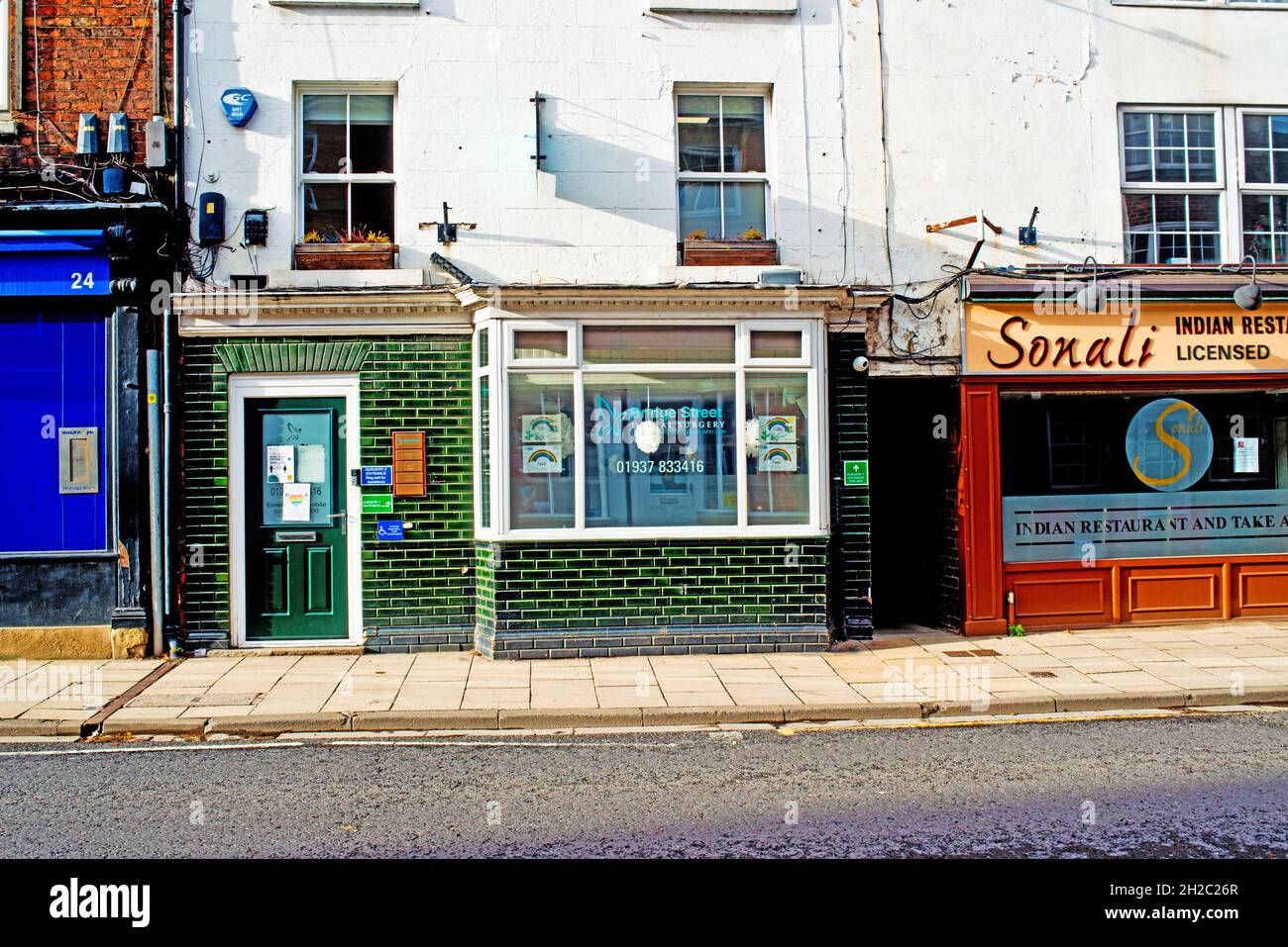 Surgery and Indian Restaurant, high street, Tadcaster, Yorkshire, England Stock Photo