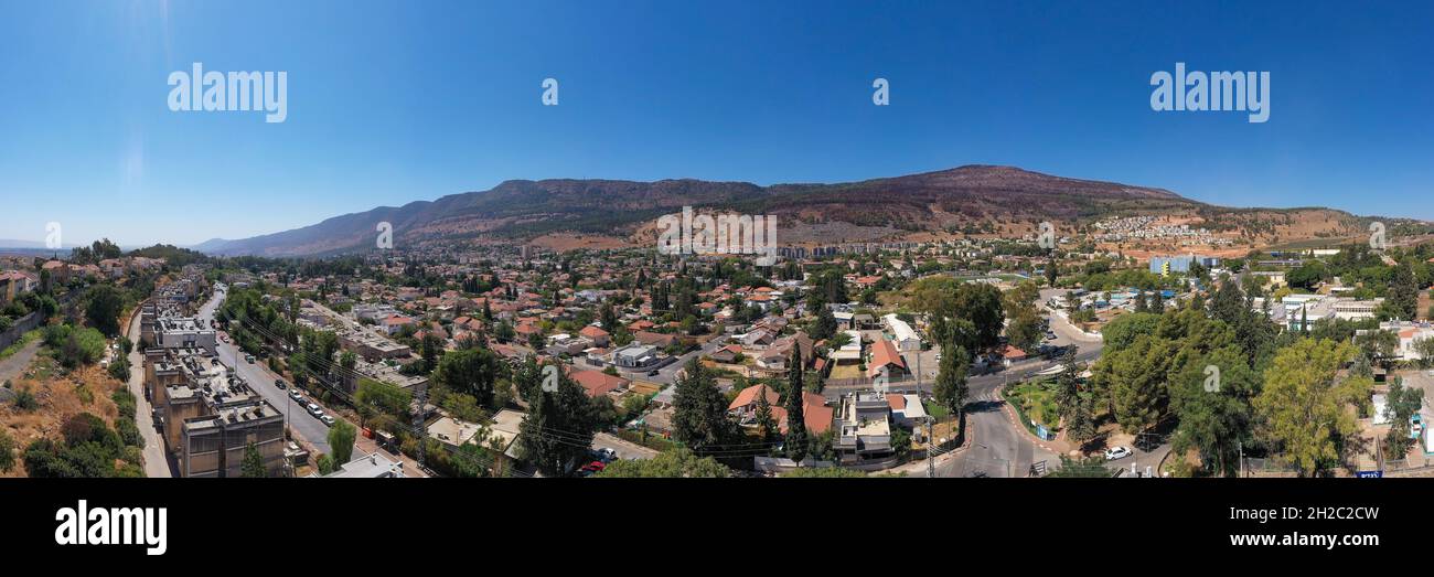Kiryat Shmona, aerial view of the city skyline surrounded by mountains. Stock Photo