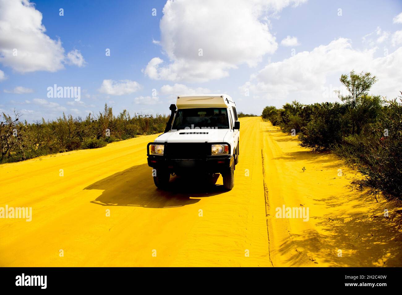 Dust road in the Kalbarri National Park with off-road vehicle, Australia, Western Australia, Kalbarri National Park Stock Photo