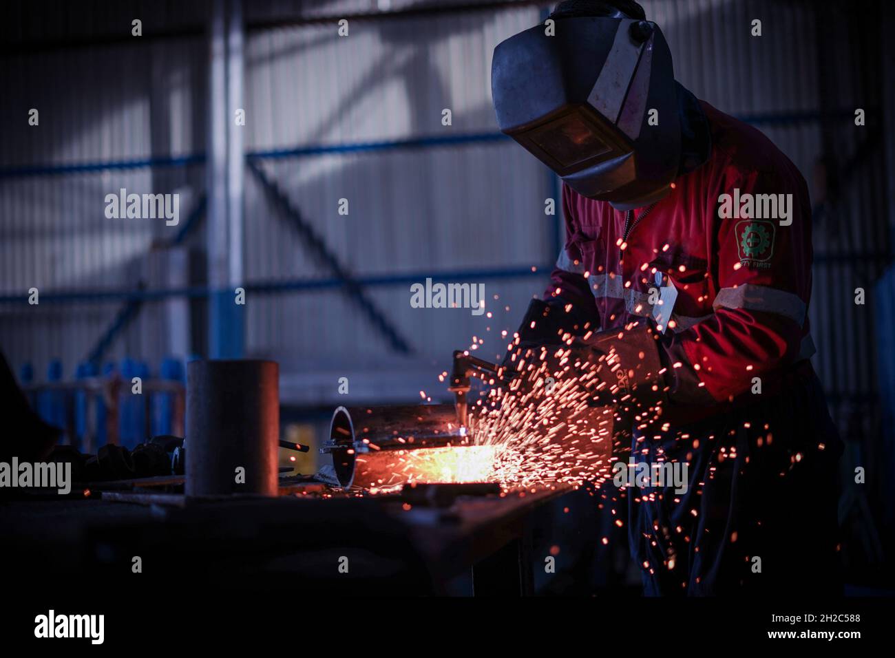 The welding or grinding works that produce steel sparks turn the hard work into beauty of light spark Stock Photo