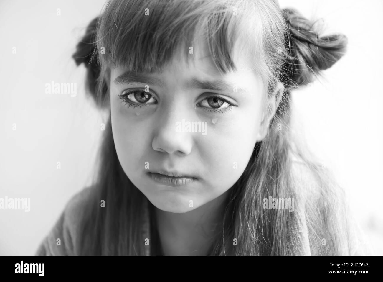 Portrait of sad little girl, black and white effect Stock Photo Alamy