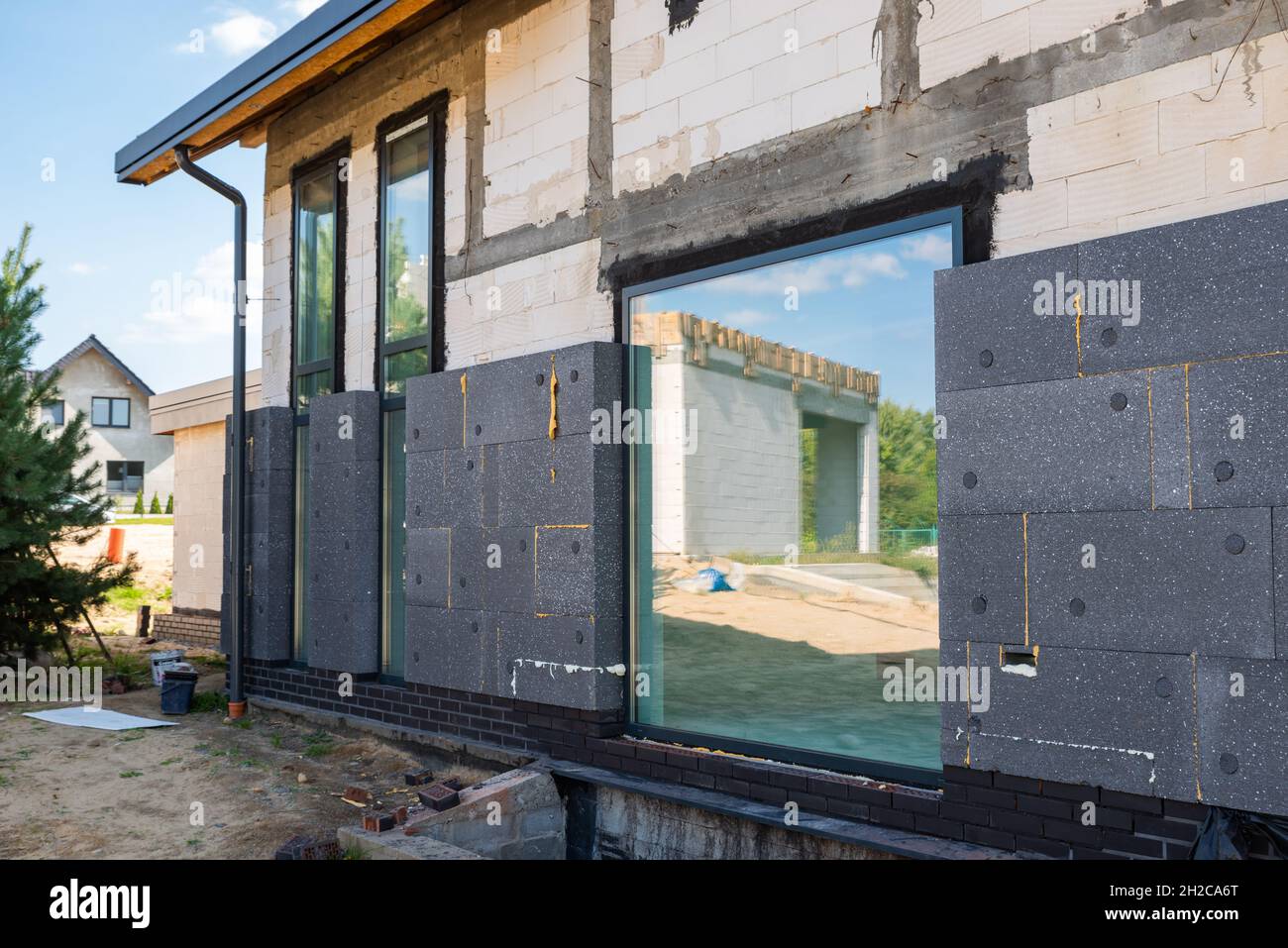 facade with thermal insulation of a single-family house Stock Photo - Alamy