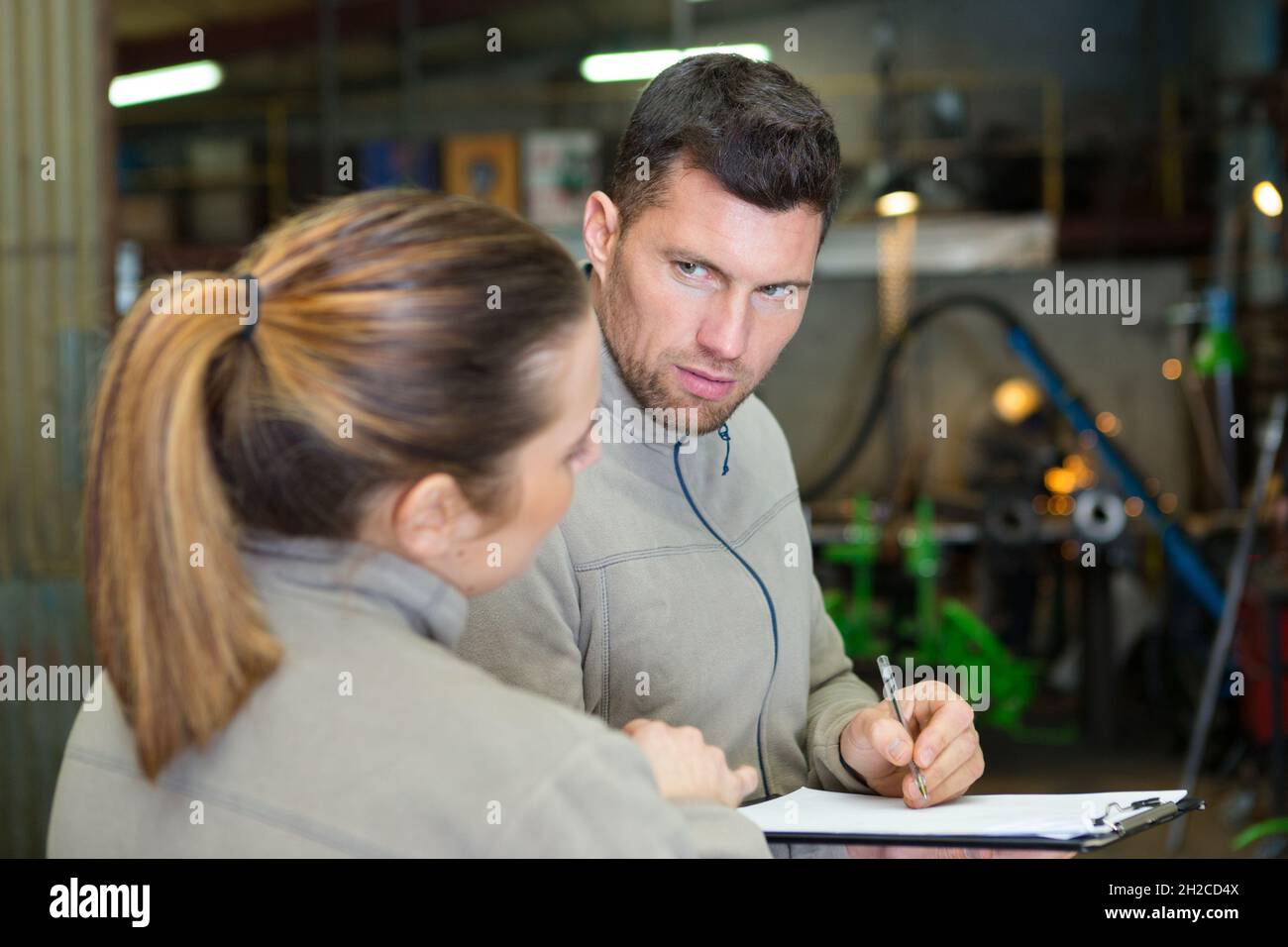 agricultural technician and mechanic having conversation Stock Photo